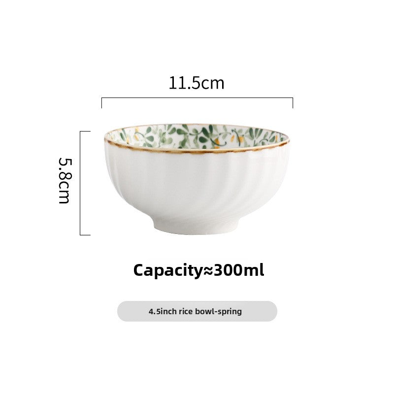 Round green leaf porcelain dish on a pale kitchen table