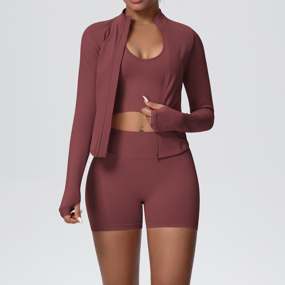 Brown seamless activewear set, zip jacket with thumbhole cuffs over cropped tank and shorts