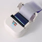 Open white mini printer showing the blue thermal transfer ribbon cartridge above the print head