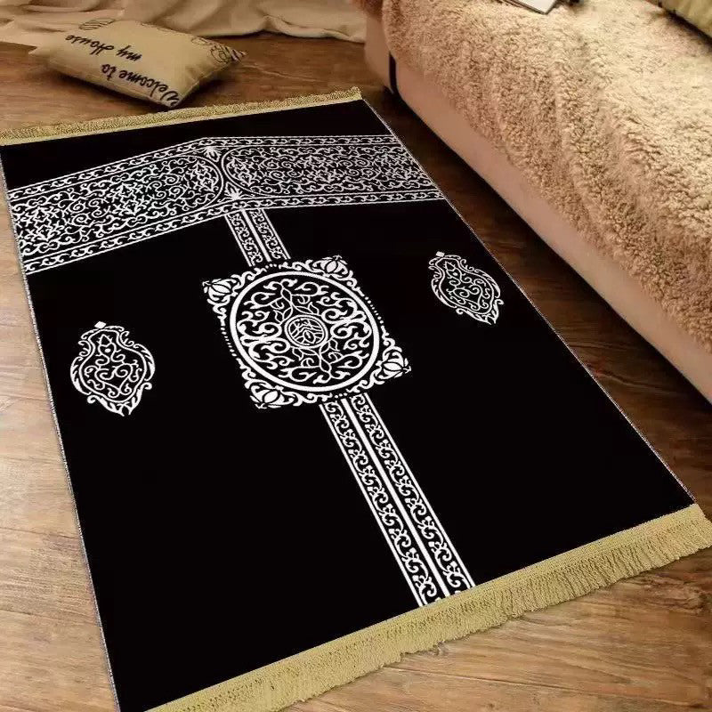 Plush velvet Islamic prayer mat with a printed ornamental design and fringed ends on a wood floor