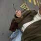 Side angle of the relaxed slightly oversized green zip-up jacket