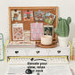 White desktop rack with three heart cutout drawers above a keyboard, with books, a mug and a plant on top