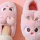 Pink cartoon bunny plush slippers seen from above on a foot, closed-heel style, option photo for size 30/31