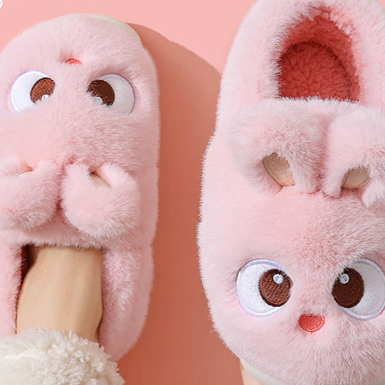 Pink cartoon bunny plush slippers seen from above on a foot, closed-heel style, option photo for size 30/31