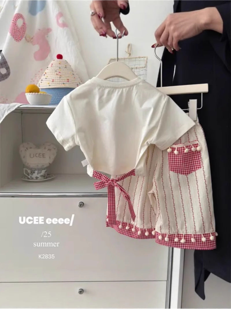 Bow print short sleeve set on a young girl during a relaxed daytime moment