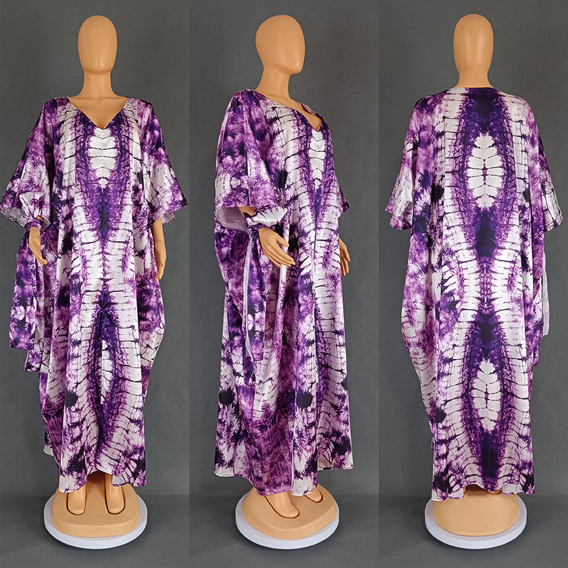 Close view of the marbled tie dye print on the satin finish kaftan maxi dress fabric