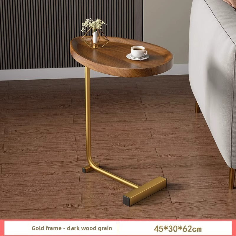 Side view of the C shaped table showing the flat T base that slides under a sofa