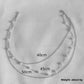 Layered rhinestone Y drop necklace shown flat to reveal both chain lengths
