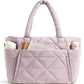 Quilted shoulder bag worn on the shoulder to show the handle drop and size