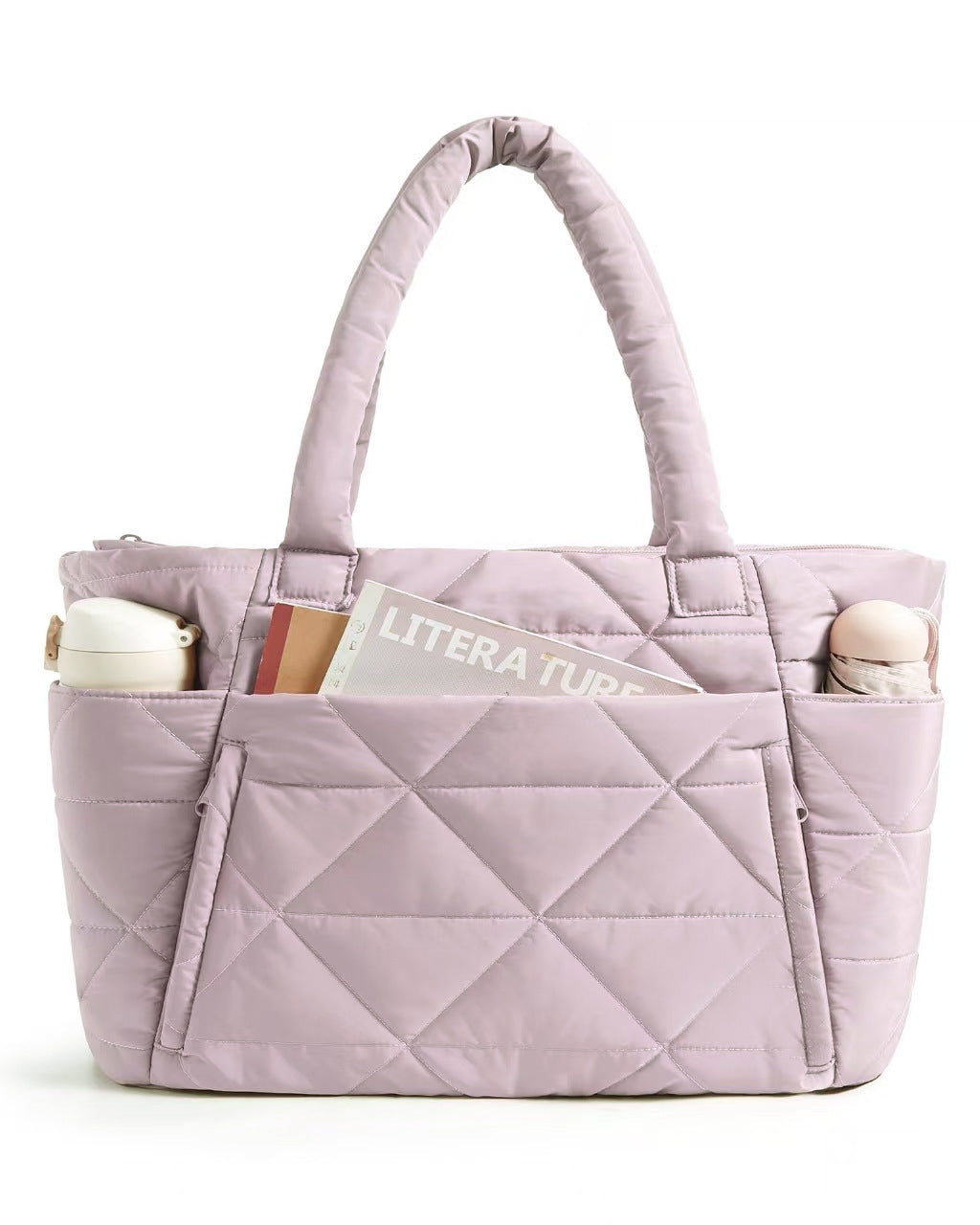 Quilted shoulder bag worn on the shoulder to show the handle drop and size