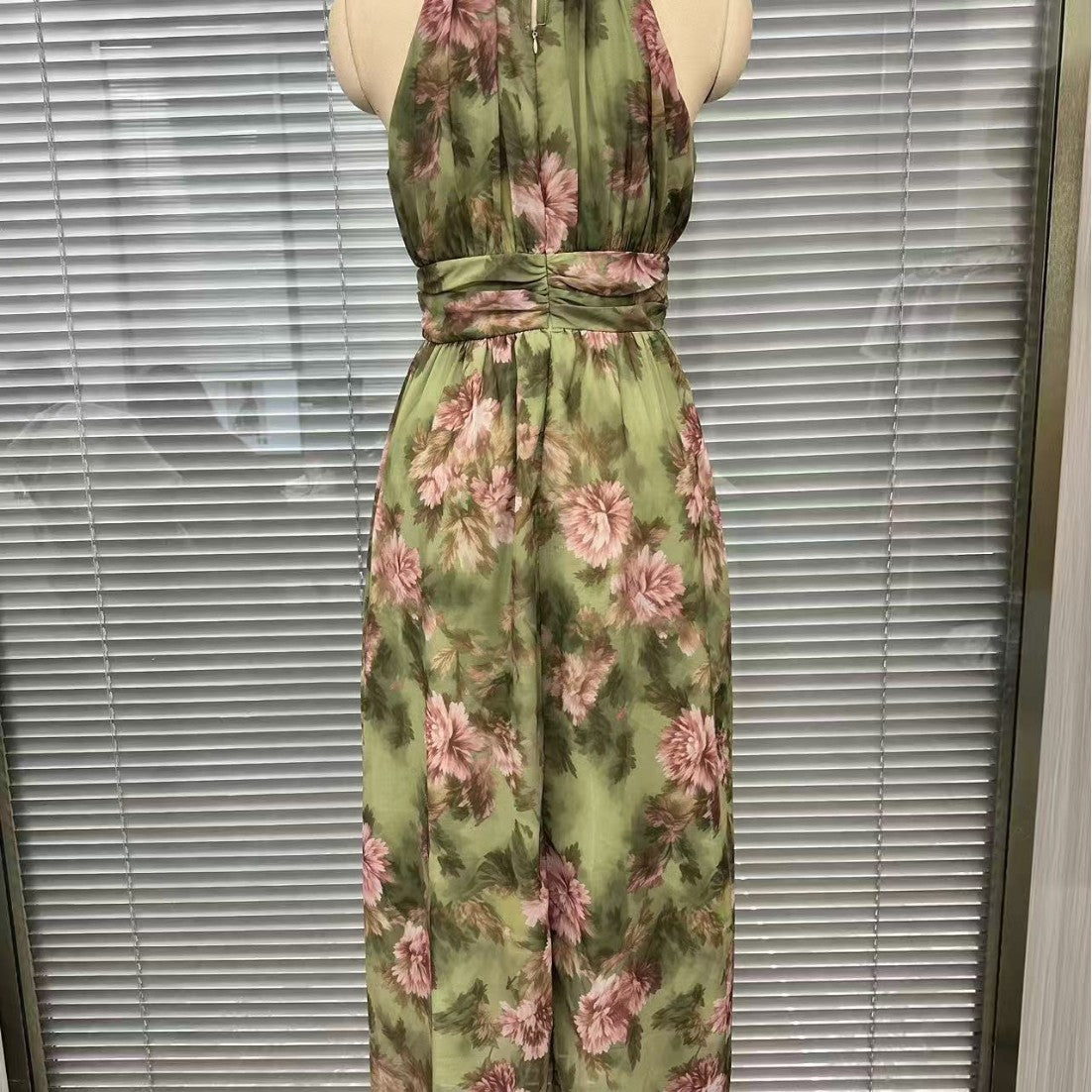 Side profile of the green slimming dress showing how the skirt falls over the hips
