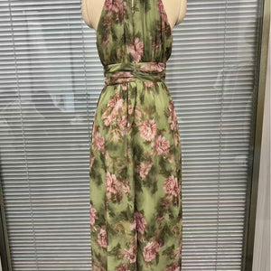 Side profile of the green slimming dress showing how the skirt falls over the hips