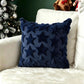 Plush carved cushion cover with carved bells and bows on the soft plush ground