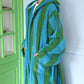 Blue and green wide striped hooded cotton terry bathrobe with turned back cuffs and a front patch pocket