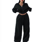 Black cropped half-zip sweatshirt and wide-leg sweatpants set on a model, size XXL option