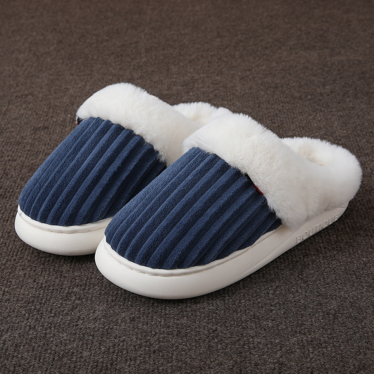 Covered toe mule slippers with a plush cuff at the opening and a thick platform sole shown