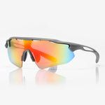 Road cyclist wearing the wraparound glasses on a sunny climb