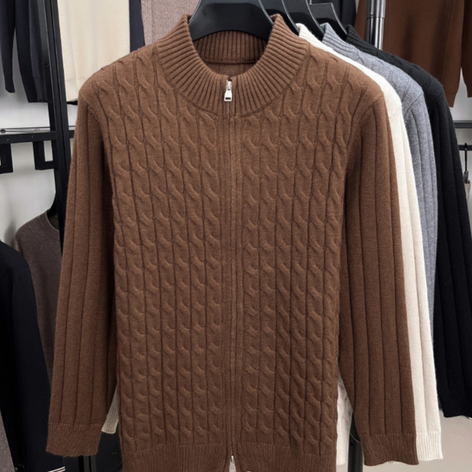 Ribbed hem and cuff of the thick knit half zip sweater