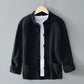 Black frog closure shirt jacket with stand collar on a hanger over a white tee, image of the size M option