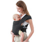Dark grey cotton front baby carrier worn with a baby held close and facing the wearer's chest