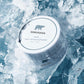 SIIMUNANA PAP+ teeth whitening powder tub resting on crushed ice with the polar bear logo on the lid