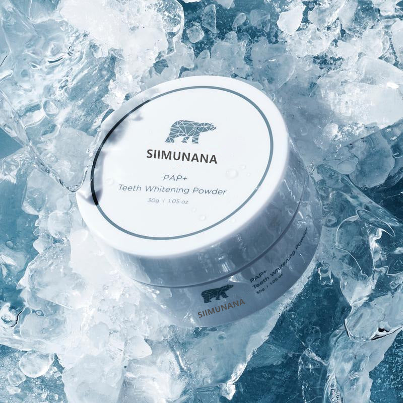 SIIMUNANA PAP+ teeth whitening powder tub resting on crushed ice with the polar bear logo on the lid