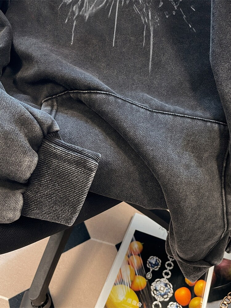 Ribbed cuff and hem detail of the washed black hooded sweatshirt
