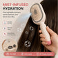 Cream mist spray hair brush releasing a fine water mist over long brown hair