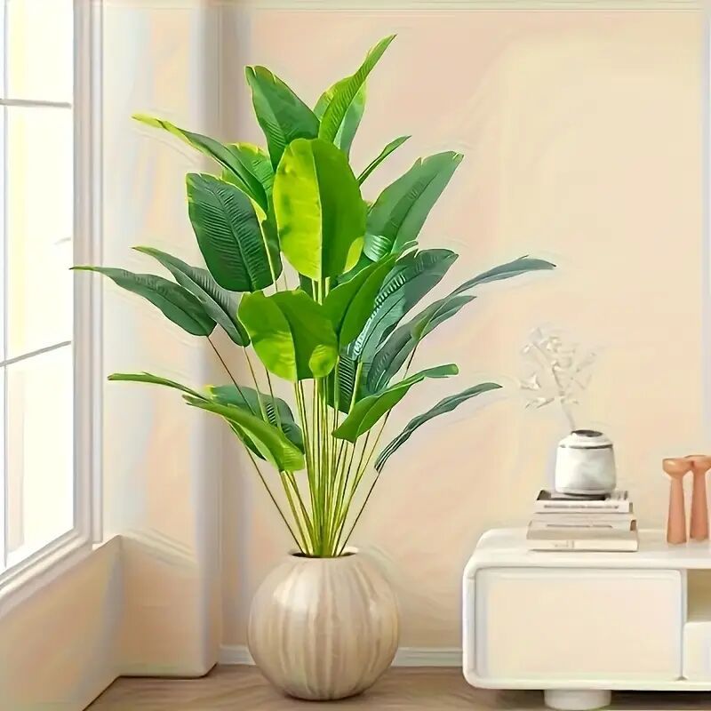 Artificial traveler banana plant held to show its 80 cm height