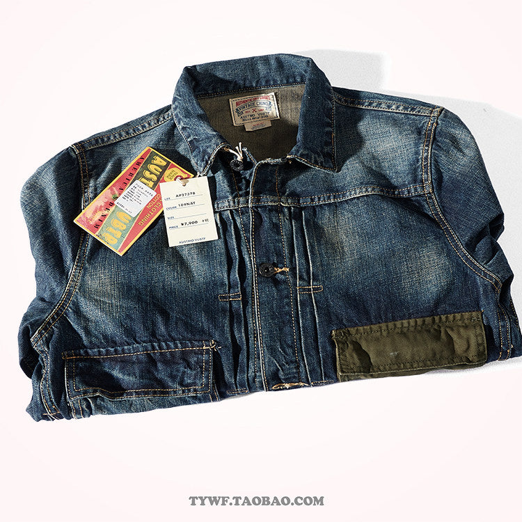 Folded retro denim jacket showing vintage paper hang tags and notch lapel collar