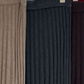 Close up of ribbed knit swatches in tan, deep gray and dark burgundy