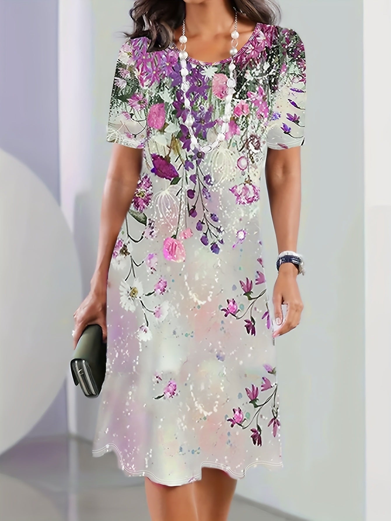 Floral print short sleeve dress showing the knee length overlapping front hem