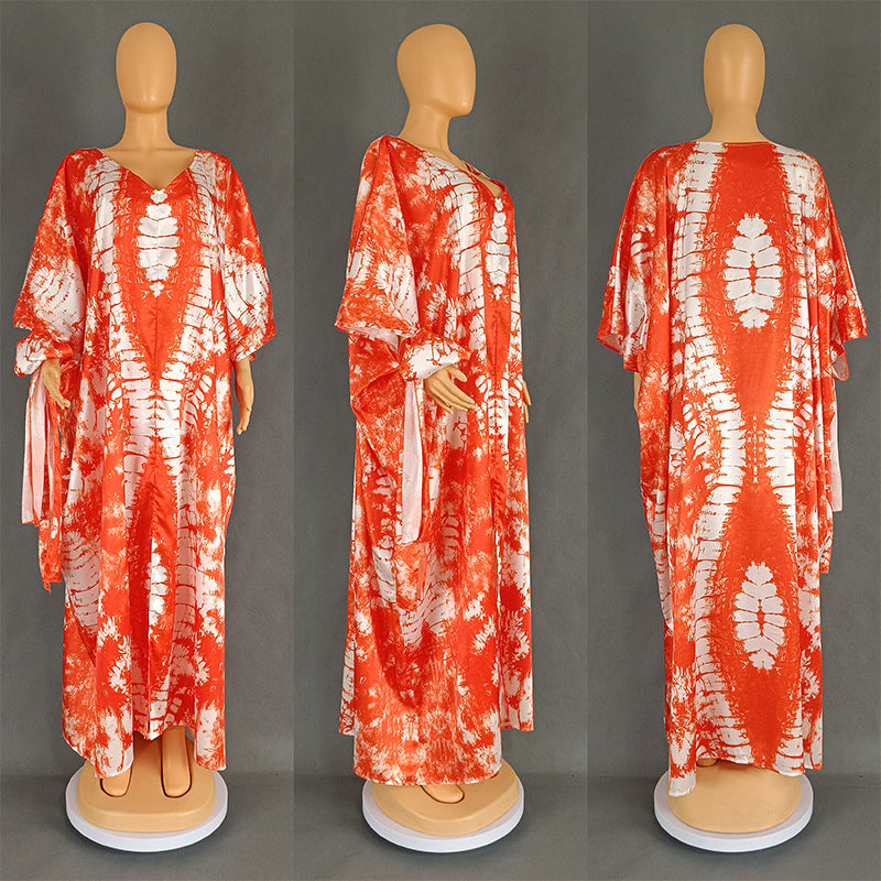 Tie dye V neck kaftan maxi dress with open batwing sleeves shown on a standing model