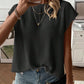 Round neck short cap sleeve knit top shown on a model in a soft solid color