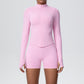 Back view of the fitted seamless zip jacket and high waist shorts set