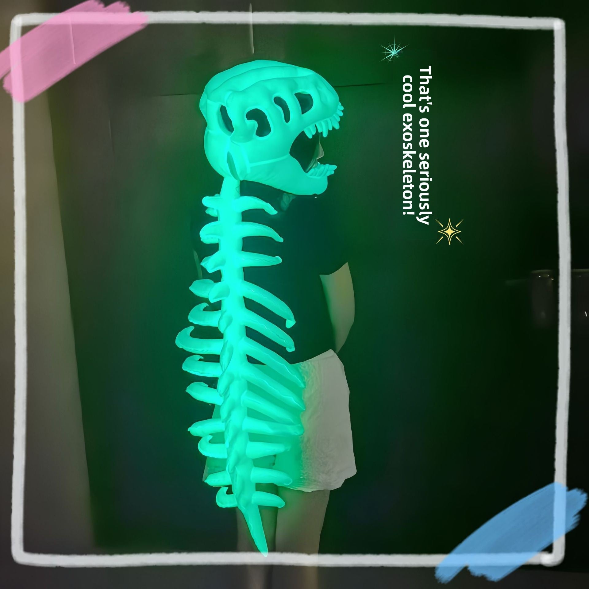 Child in profile wearing a glowing green dinosaur skull and ribbed spine costume in a dark room