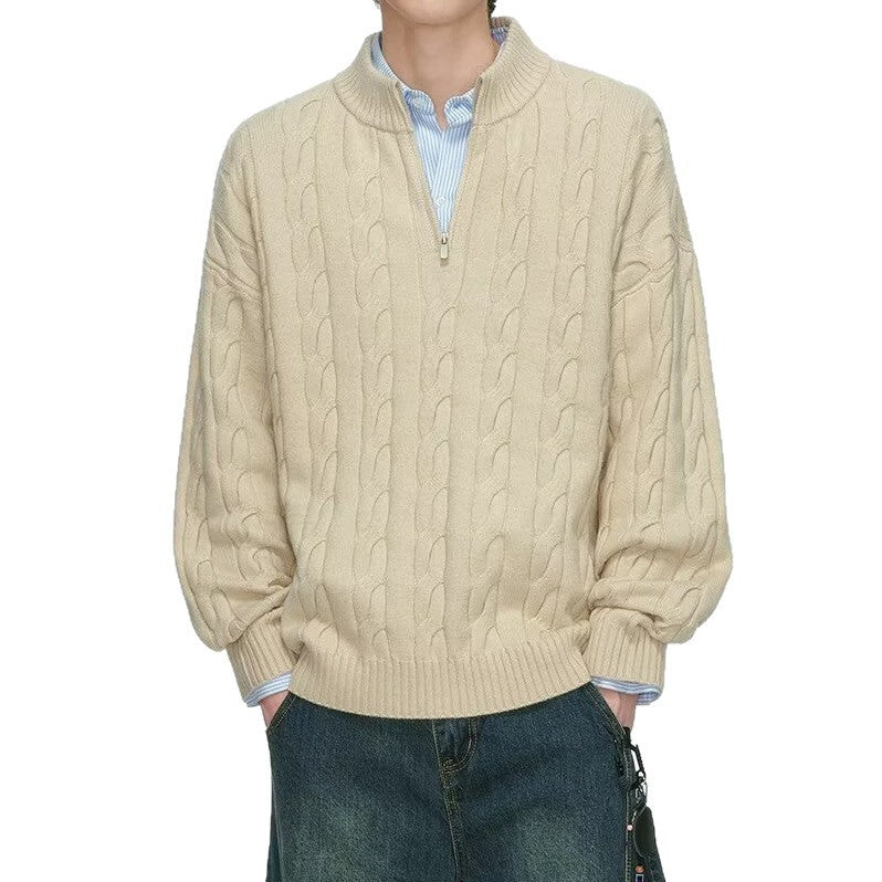 Cream half zip cable knit sweater with dropped shoulders on a model against a white background, torso view