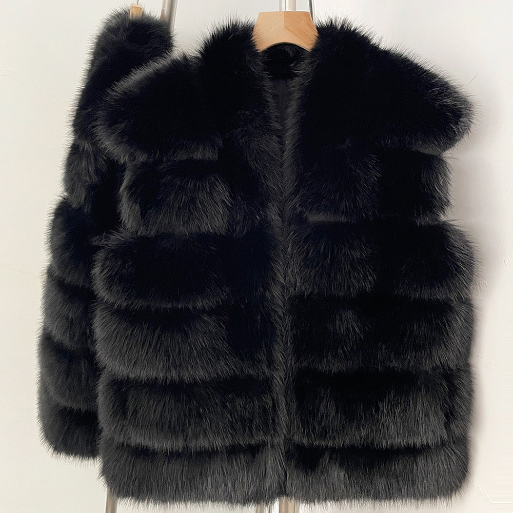 Black tiered vegan fur sleeveless vest in size M, front view on a wooden hanger