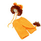 Orange knit lion bonnet with a brown mane and matching knit shorts on a white background