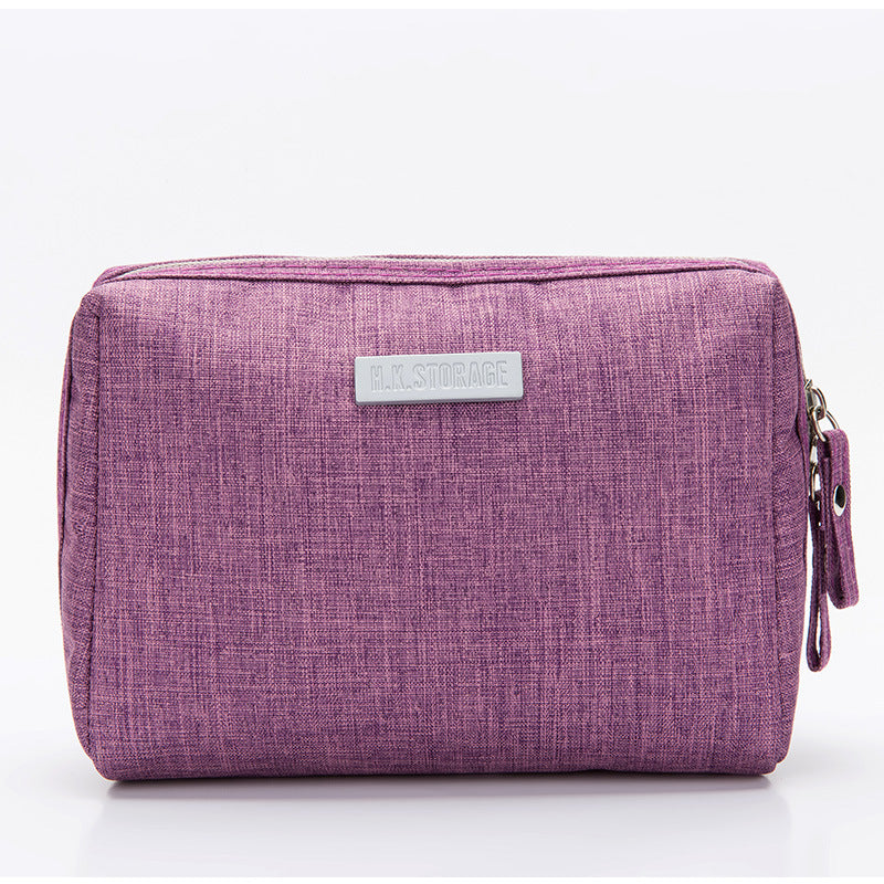 Water resistant Oxford cloth toiletry bag zipped closed showing the cube shape