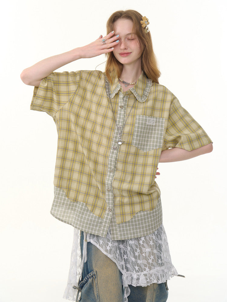 Close up of plaid weave and doll collar on green short sleeve shirt