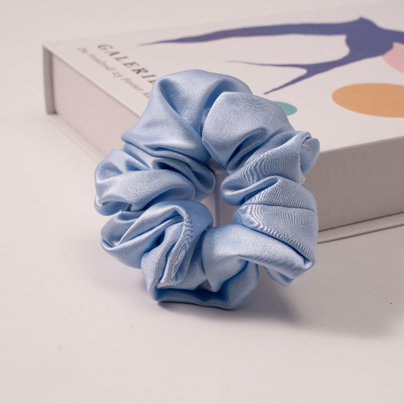 Pink satin scrunchie with black polka dots