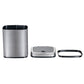 The bin taken apart on white, steel outer bucket, lid module with sensor, and black retaining ring