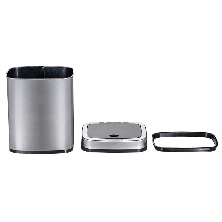The bin taken apart on white, steel outer bucket, lid module with sensor, and black retaining ring