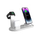 White four in one charging stand holding a phone, a smartwatch and wireless earbuds