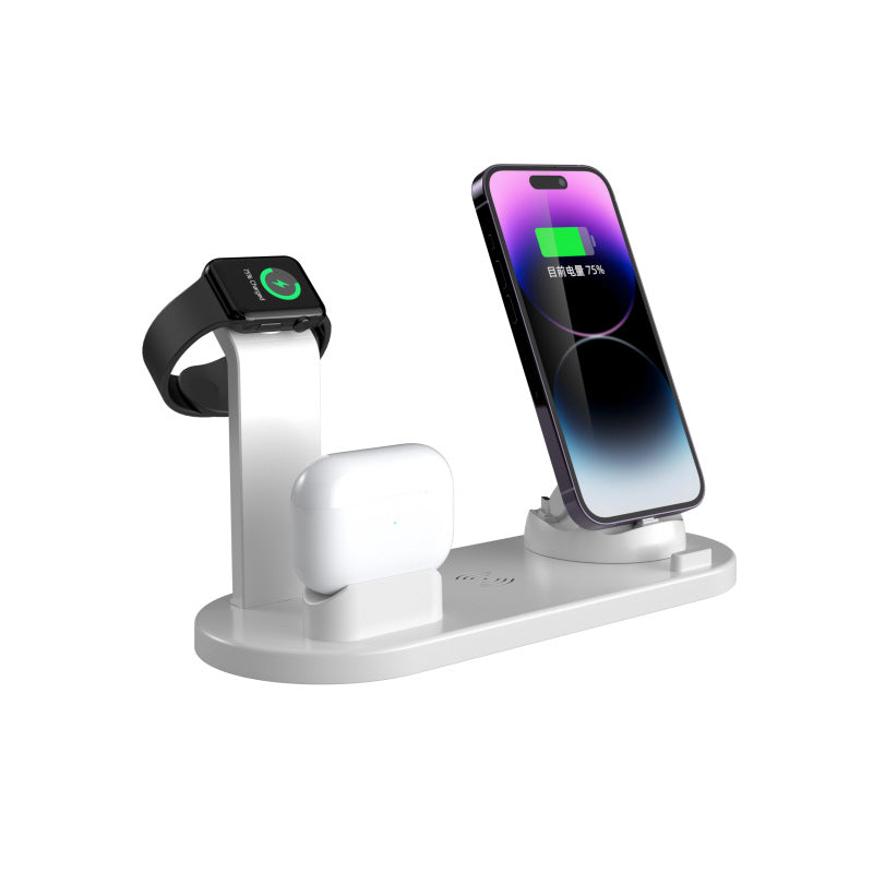 White four in one charging stand holding a phone, a smartwatch and wireless earbuds