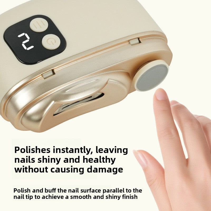 Close up of the beige electric nail clipper with a gear display, two buttons and a gray polishing disc beside a fingertip