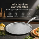 Hammered flat pan with a long metal handle on a dark kitchen counter beside lemons and a pizza