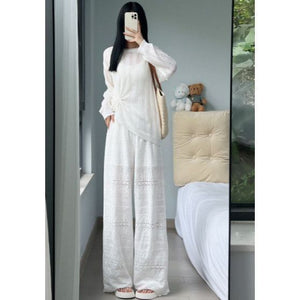 Black eyelet wide-leg pants full length front view with high elastic waist