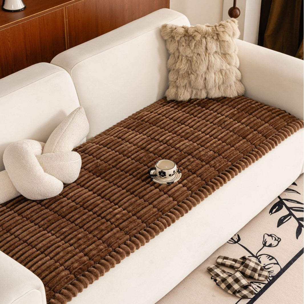 Sweet Serene Brown quilted plush sofa cover on a sofa, 90 x 210 cm